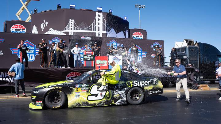 Jun 27, 2026; Sonoma, California, USA;  SuperFile driver Shane Van Gisbergen (9) gets showered by teammates after winning the NASCAR O’Reilly Auto Parts Series Race at Sonoma Raceway.