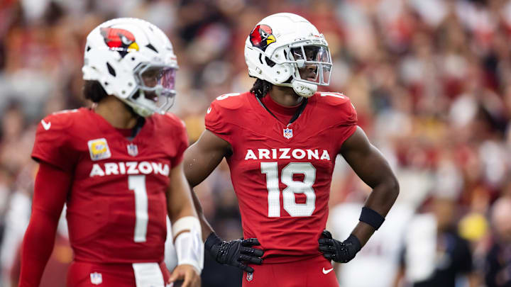 Sep 29, 2024; Glendale, Arizona, USA; Arizona Cardinals wide receiver Marvin Harrison Jr. (18) alongside quarterback Kyler Murray (1) against the Washington Commanders in the first half at State Farm Stadium. Mandatory Credit: Mark J. Rebilas-Imagn Images