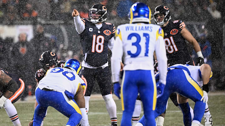 Caleb Williams calls the snap count against the Los Angeles Rams during the NFC divisional playoff game at Soldier Field. Caleb Williams calls the snap count against the Los Angeles Rams during the NFC divisional playoff game at Soldier Field.