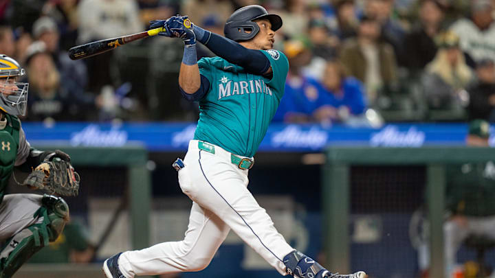 Seattle Mariners designated hitter Jorge Polanco hits a single against the Oakland Athletics on Sept. 28 at T-Mobile Park.