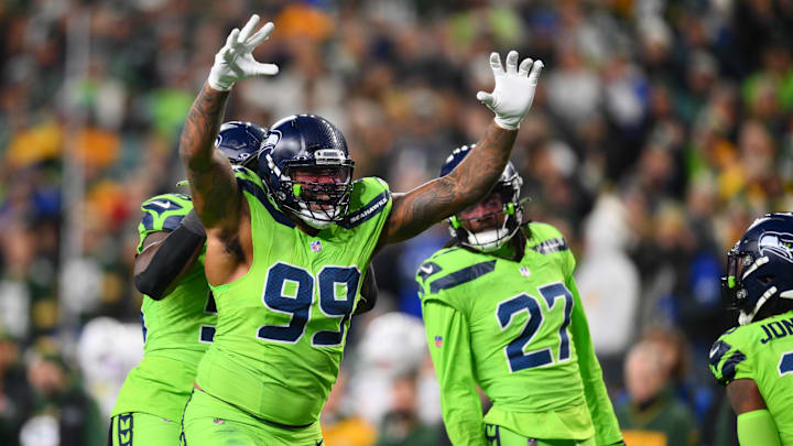 Dec 15, 2024; Seattle, Washington, USA; Seattle Seahawks defensive end Leonard Williams (99) celebrates after a defensive play against the Green Bay Packers during the second half at Lumen Field.