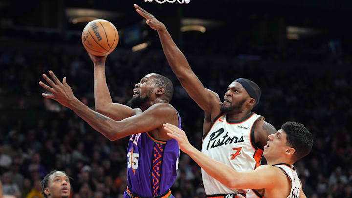 Dec 21, 2024; Phoenix, Arizona, USA; Phoenix Suns forward Kevin Durant (35) drives against Detroit Pistons defenders during the first half at Footprint Center. Mandatory Credit: Joe Camporeale-Imagn Images Dec 21, 2024; Phoenix, Arizona, USA; Phoenix Suns forward Kevin Durant (35) drives against Detroit Pistons defenders during the first half at Footprint Center. Mandatory Credit: Joe Camporeale-Imagn Images