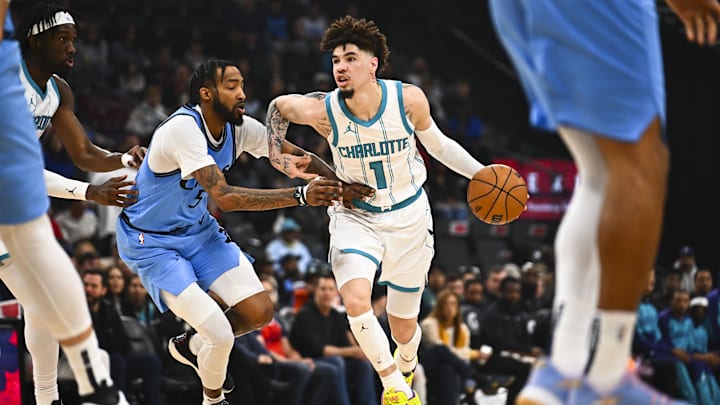 Mar 16, 2025; Inglewood, California, USA; Charlotte Hornets guard LaMelo Ball (1) moves the ball against LA Clippers forward Derrick Jones Jr. (55) during the first half at Intuit Dome. Mandatory Credit: Jonathan Hui-Imagn Images Mar 16, 2025; Inglewood, California, USA; Charlotte Hornets guard LaMelo Ball (1) moves the ball against LA Clippers forward Derrick Jones Jr. (55) during the first half at Intuit Dome. Mandatory Credit: Jonathan Hui-Imagn Images