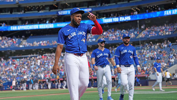 Sep 29, 2024; Toronto, Ontario, CAN; Toronto Blue Jays designated hitter Vladimir Guerrero Jr. (27) walks back to the dugout before the start of a game against the Miami Marlins at Rogers Centre.