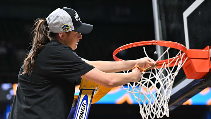 Mar 30, 2025; Spokane, WA, USA; UCLA Bruins guard Gabriela Jaquez (11) cuts part of the net after a Elite 8 NCAA Tournament basketball game against the LSU Lady Tigers at Spokane Arena. Mandatory Credit: James Snook-Imagn Images