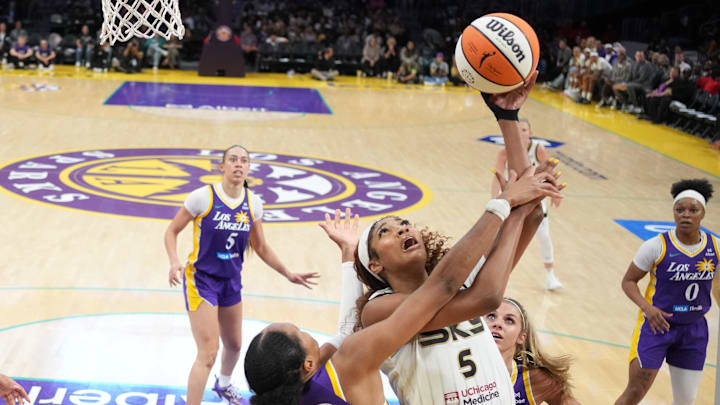 May 25, 2025; Los Angeles, California, USA; Chicago Sky forward Angel Reese (5) shoots the ball against LA Sparks forward Azura Stevens (23) and guard Julie Allemand (20) in the second half at Crypto.com Arena. Mandatory Credit: Kirby Lee-Imagn Images