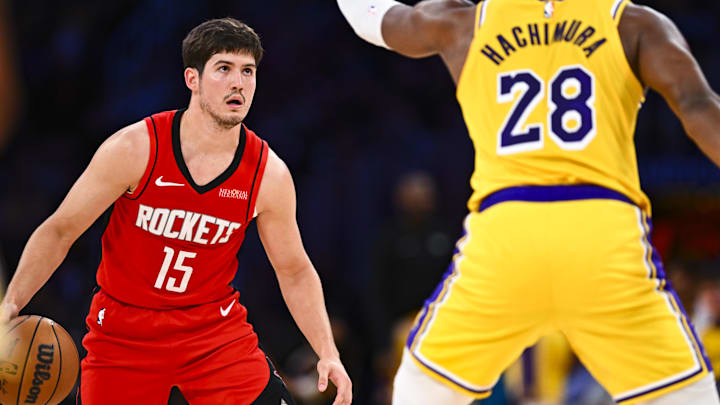 Apr 11, 2025; Los Angeles, California, USA; Houston Rockets guard Reed Sheppard (15) looks to shoot against Los Angeles Lakers forward Rui Hachimura (28) during the second half at Crypto.com Arena. Mandatory Credit: Jonathan Hui-Imagn Images