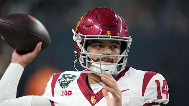 Dec 27, 2024; Las Vegas, NV, USA; Southern California Trojans quarterback Jayden Maiava (14) throws the ball against the Texas A&M Aggies in the first half at Allegiant Stadium. Mandatory Credit: Kirby Lee-Imagn Images
