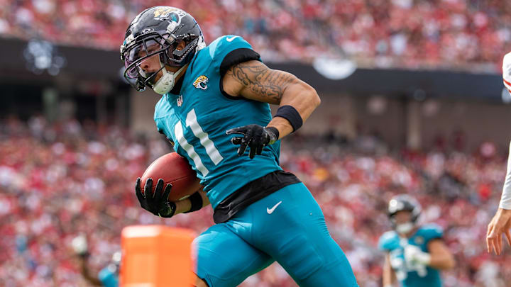 September 28, 2025; Santa Clara, California, USA; Jacksonville Jaguars wide receiver Parker Washington (11) scores a touchdown during the third quarter against the San Francisco 49ers at Levi's Stadium. Mandatory Credit: Kyle Terada-Imagn Images