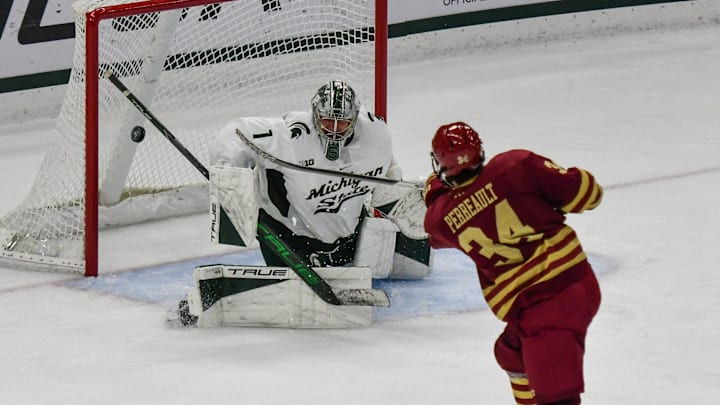 Gabe Perreault of Boston College scores against MSU goaltender Trey Augustine, Saturday, Oct. 12, 2024, at Munn Ice Arena in East Lansing. MSU won 4-3.