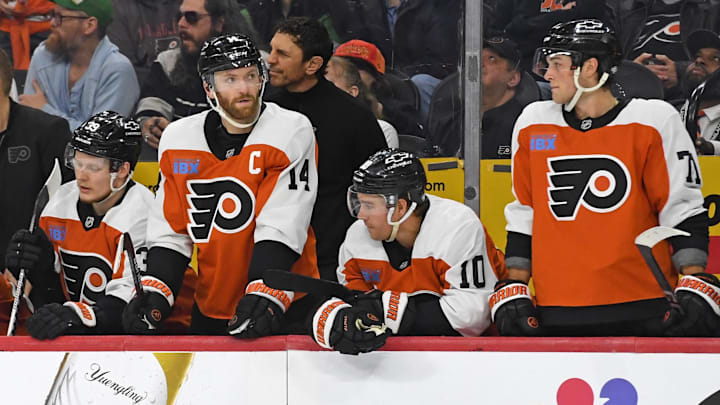 Apr 15, 2025; Philadelphia, Pennsylvania, USA; Philadelphia Flyers right wing Matvei Michkov (39), center Sean Couturier (14), right wing Bobby Brink (10) and right wing Tyson Foerster (71) watch the final seconds of loss to the Columbus Blue Jackets during the third period at Wells Fargo Center. Mandatory Credit: Eric Hartline-Imagn Images