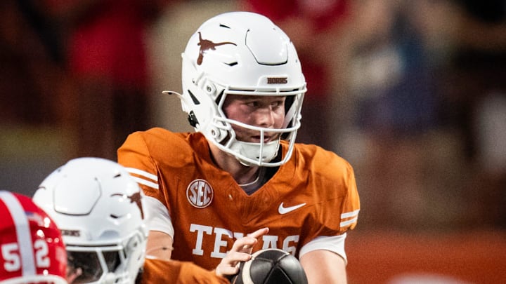 Texas Longhorns quarterback Quinn Ewers (3) catches a snap in the first quarter of the Longhorns' game against the Georgia Bulldogs at Darrell K. Royal Texas Memorial Stadium in Austin, Oct. 19, 2024.