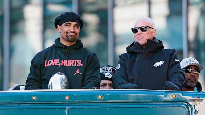 Philadelphia Eagles quarterback Jalen Hurts speaks to team owner Jeffrey Lurie during the Super Bowl LIX championship parade.