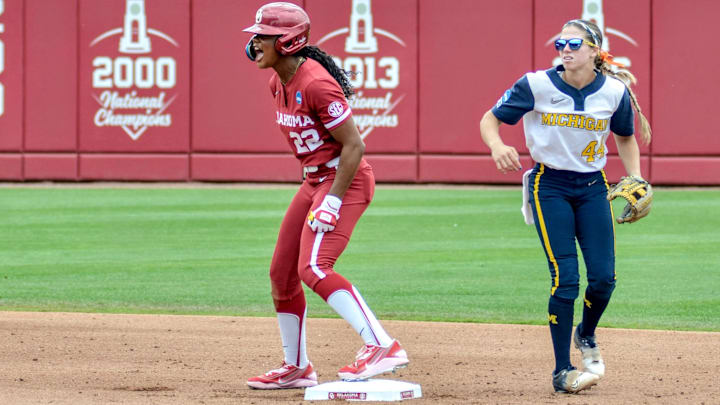 Oklahoma outfielder Kai Minor celebrates after opening Sunday's NCAA Tournament contest against Michigan with a double.