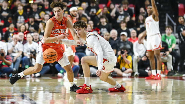 Mar 8, 2026; College Park, Maryland, USA; Illinois Fighting Illini guard Keaton Wagler (23) and Maryland Terrapins guard Guillermo del Pino (18) scramble for a loose ball during the first half at Xfinity Center. Mandatory Credit: Tommy Gilligan-Imagn Images Mar 8, 2026; College Park, Maryland, USA; Illinois Fighting Illini guard Keaton Wagler (23) and Maryland Terrapins guard Guillermo del Pino (18) scramble for a loose ball during the first half at Xfinity Center. Mandatory Credit: Tommy Gilligan-Imagn Images