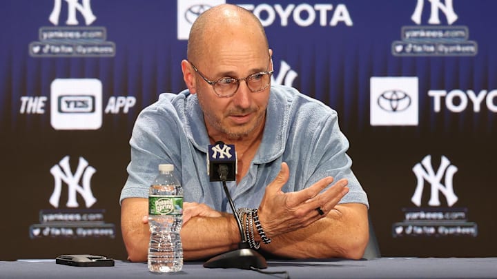 Aug 23, 2023; Bronx, New York, USA; New York Yankees general manager Brian Cashman talks with the media before the game between the Yankees and the Washington Nationals at Yankee Stadium. Mandatory Credit: Vincent Carchietta-Imagn Images