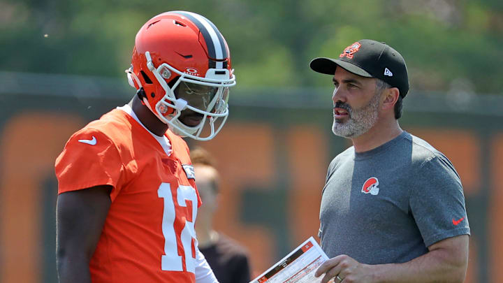 Cleveland Browns quarterback Shedeur Sanders (12) speaks with head coach Kevin Stefanski during practice at NFL minicamp, Wednesday, June 11, 2025, in Berea, Ohio.