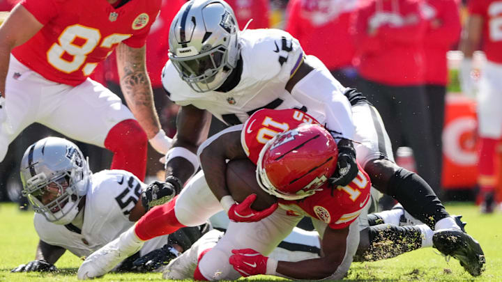 Oct 19, 2025; Kansas City, Missouri, USA; Las Vegas Raiders linebacker Devin White (45) tackles Kansas City Chiefs running back Isiah Pacheco (10) during the second quarter of the game at GEHA Field at Arrowhead Stadium. Mandatory Credit: Denny Medley-Imagn Images