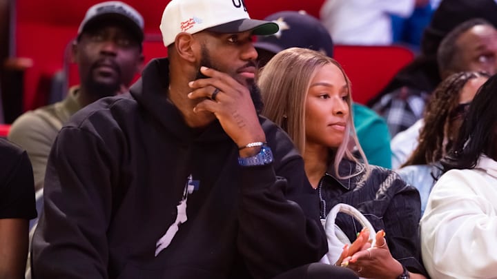 Los Angeles Lakers forward LeBron James (left) and wife Savannah James courtside during the McDonald's All American Boy's high school basketball game. Los Angeles Lakers forward LeBron James (left) and wife Savannah James courtside during the McDonald's All American Boy's high school basketball game.