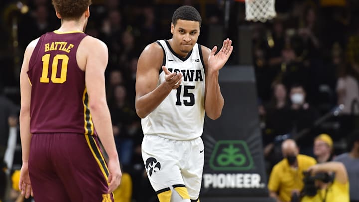 Feb 6, 2022; Iowa City, Iowa, USA; Iowa Hawkeyes forward Keegan Murray (15) reacts during the second half as Minnesota Golden Gophers forward Jamison Battle (10) looks on at Carver-Hawkeye Arena. Mandatory Credit: Jeffrey Becker-Imagn Images Feb 6, 2022; Iowa City, Iowa, USA; Iowa Hawkeyes forward Keegan Murray (15) reacts during the second half as Minnesota Golden Gophers forward Jamison Battle (10) looks on at Carver-Hawkeye Arena. Mandatory Credit: Jeffrey Becker-Imagn Images