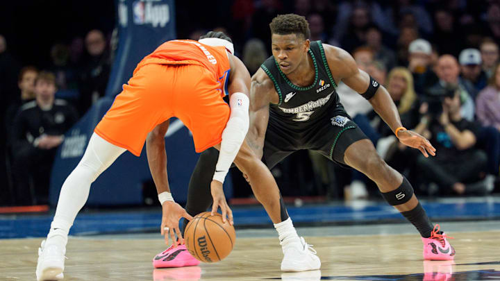 Jan 29, 2026; Minneapolis, Minnesota, USA; Minnesota Timberwolves guard Anthony Edwards (5) defends Oklahoma City Thunder guard Shai Gilgeous-Alexander (2) in the first quarter at Target Center.