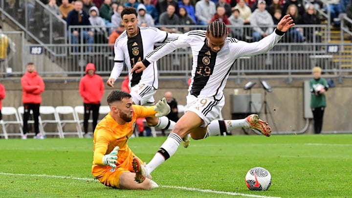 Oct 14, 2023; East Hartford, Connecticut, USA; Germany forward Leroy Sane (19) against United States goalkeeper Matt Turner (1) during the first half at Pratt & Whitney Stadium. Mandatory Credit: Eric Canha-Imagn Images