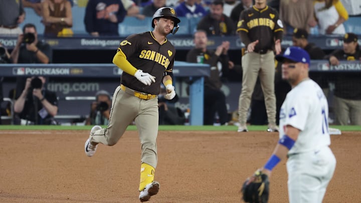 Oct 6, 2024; Los Angeles, California, USA; San Diego Padres catcher Kyle Higashioka (20) runs after hitting a solo home run against the Los Angeles Dodgers in the ninth inning during game two of the NLDS for the 2024 MLB Playoffs at Dodger Stadium. Mandatory Credit: Kiyoshi Mio-Imagn Images Oct 6, 2024; Los Angeles, California, USA; San Diego Padres catcher Kyle Higashioka (20) runs after hitting a solo home run against the Los Angeles Dodgers in the ninth inning during game two of the NLDS for the 2024 MLB Playoffs at Dodger Stadium. Mandatory Credit: Kiyoshi Mio-Imagn Images