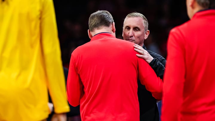 Arizona Wildcats head coach Tommy Lloyd shakes hands with Arizona State Sun Devils head coach Bobby Hurley before the start of the game at McKale Center.