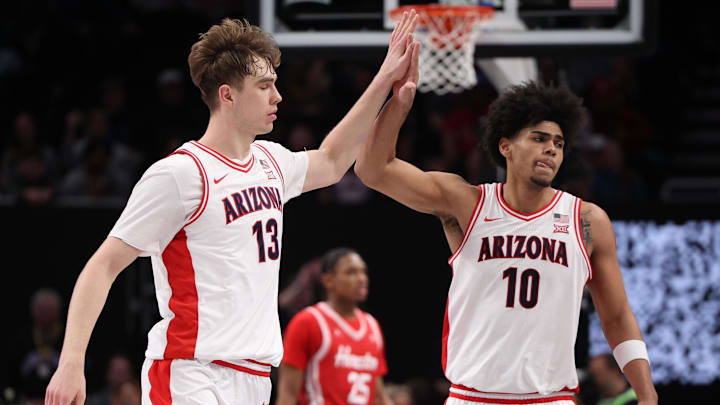 Arizona Wildcats center Motiejus Krivas (13) and forward Koa Peat (10) high-five. Arizona Wildcats center Motiejus Krivas (13) and forward Koa Peat (10) high-five.