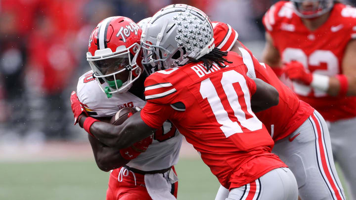Oct 7, 2023; Columbus, Ohio, USA; Maryland Terrapins wide receiver Tai Felton (10) runs the ball as Ohio State Buckeyes cornerback Denzel Burke (10) makes the tackle during the second quarter at Ohio Stadium. Mandatory Credit: Joseph Maiorana-USA TODAY Sports Oct 7, 2023; Columbus, Ohio, USA; Maryland Terrapins wide receiver Tai Felton (10) runs the ball as Ohio State Buckeyes cornerback Denzel Burke (10) makes the tackle during the second quarter at Ohio Stadium. Mandatory Credit: Joseph Maiorana-USA TODAY Sports