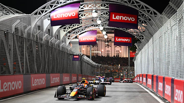 SINGAPORE, SINGAPORE - SEPTEMBER 22: Sergio Perez of Mexico driving the (11) Oracle Red Bull Racing RB20 leads Yuki Tsunoda of Japan driving the (22) Visa Cash App RB VCARB 01 on track during the F1 Grand Prix of Singapore at Marina Bay Street Circuit on September 22, 2024 in Singapore, Singapore. (Photo by Clive Mason/Getty Images) SINGAPORE, SINGAPORE - SEPTEMBER 22: Sergio Perez of Mexico driving the (11) Oracle Red Bull Racing RB20 leads Yuki Tsunoda of Japan driving the (22) Visa Cash App RB VCARB 01 on track during the F1 Grand Prix of Singapore at Marina Bay Street Circuit on September 22, 2024 in Singapore, Singapore. (Photo by Clive Mason/Getty Images)