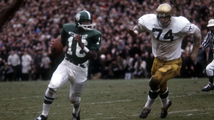 Nov 19, 1966; East Lansing, MI, USA: FILE PHOTO; Notre Dame Irish defensive tackle (74) Kevin Hardy pressures Michigan State Spartans quarterback (16) Jim Raye. Notre Dame and Michigan State played to a tie 10-10 at Spartans Stadium. Mandatory Credit: Photo By Malcolm Emmons- USA TODAY Sports © copyright Malcolm Emmons