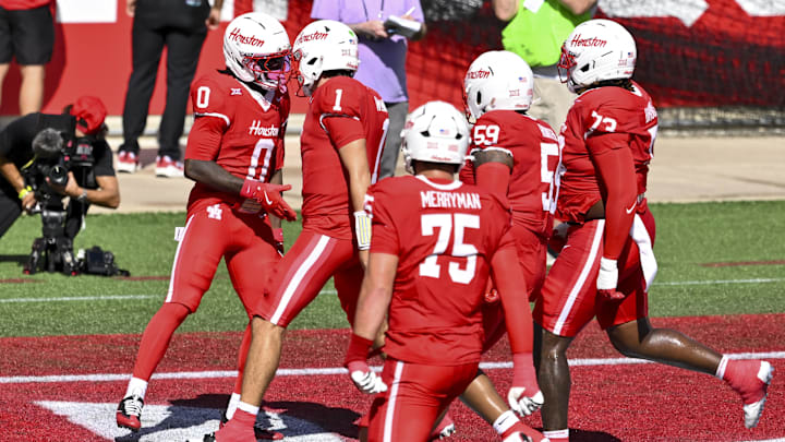 Oct 18, 2025; Houston, Texas, USA; Houston Cougars wide receiver Amare Thomas (0) celebrates with teammates after scoring a touchdown during the first quarter against the Arizona Wildcats at TDECU Stadium.