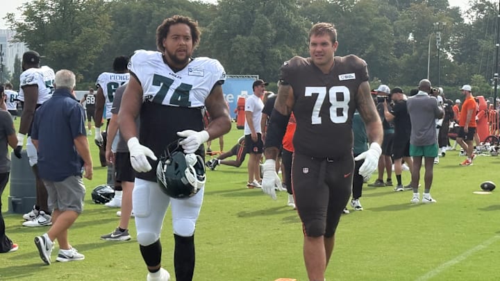 Offensive tackles Kendall Lamm of the Eagles (74) and Jack Conkin of the Browns head to a drill during their practice on Aug. 13, 2025. Offensive tackles Kendall Lamm of the Eagles (74) and Jack Conkin of the Browns head to a drill during their practice on Aug. 13, 2025.
