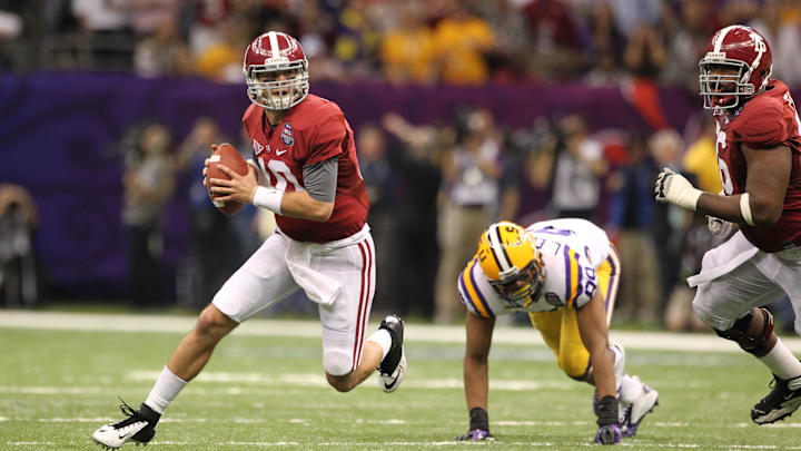 Jan 9, 2012; New Orleans, LA, USA; Alabama Crimson Tide quarterback A.J. McCarron (10) scrambles with the ball against the LSU Tigers in the 2012 BCS National Championship game at the Mercedes-Benz Superdome.  Mandatory Credit: Matthew Emmons-Imagn Images
