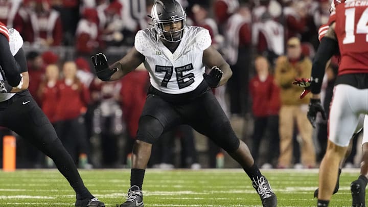 Nov 16, 2024; Madison, Wisconsin, USA;  Oregon Ducks offensive linenam Josh Conerly Jr. (76) during the game against the Wisconsin Badgers at Camp Randall Stadium. Mandatory Credit: Jeff Hanisch-Imagn Images