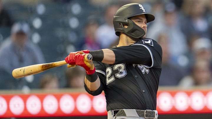 Chicago White Sox left fielder Andrew Benintendi (23) hits a single against the Minnesota Twins at Target Field. 