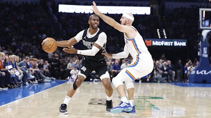 Oct 30, 2024; Oklahoma City, Oklahoma, USA; Oklahoma City Thunder guard Alex Caruso (9) defends San Antonio Spurs guard Chris Paul (3) during the second quarter at Paycom Center. Mandatory Credit: Alonzo Adams-Imagn Images