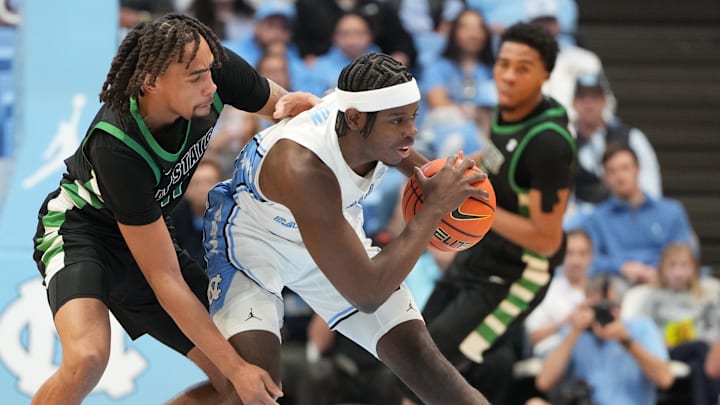 Dec 13, 2025; Chapel Hill, North Carolina, USA; North Carolina Tar Heels forward Caleb Wilson (8) with the ball as USC Upstate Spartans forward Learic Davis (11) defends in the first half at Dean E. Smith Center. Mandatory Credit: Bob Donnan-Imagn Images Dec 13, 2025; Chapel Hill, North Carolina, USA; North Carolina Tar Heels forward Caleb Wilson (8) with the ball as USC Upstate Spartans forward Learic Davis (11) defends in the first half at Dean E. Smith Center. Mandatory Credit: Bob Donnan-Imagn Images