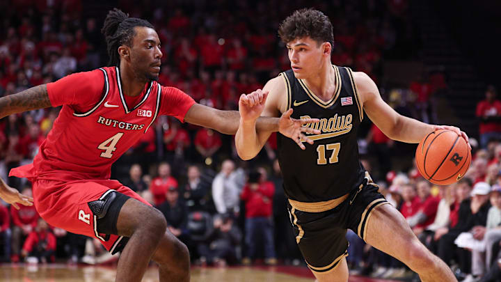 Purdue Boilermakers guard Omer Mayer (17) dribbles against Rutgers Scarlet Knights forward Bryce Dortch (4). Purdue Boilermakers guard Omer Mayer (17) dribbles against Rutgers Scarlet Knights forward Bryce Dortch (4).