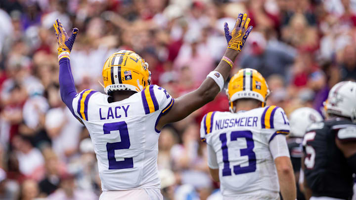 Sep 14, 2024; Columbia, South Carolina, USA;  LSU Tigers wide receiver Kyren Lacy (2) celebrates after a third quarter touchdown against the South Carolina Gamecocks in at Williams-Brice Stadium. Mandatory Credit: Scott Kinser-Imagn Images