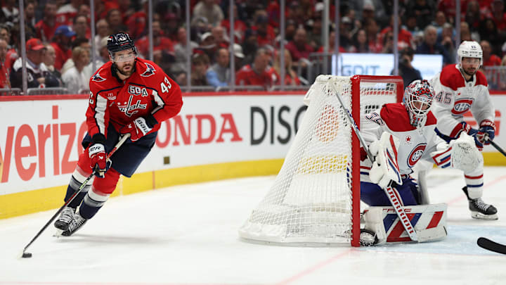 Apr 21, 2025; Washington, District of Columbia, USA; Washington Capitals right wing Tom Wilson (43) skates with the puck behind Montreal Canadiens goaltender Sam Montembeault (35) in the third period in game one of the first round of the 2025 Stanley Cup Playoffs at Capital One Arena. Mandatory Credit: Geoff Burke-Imagn Images