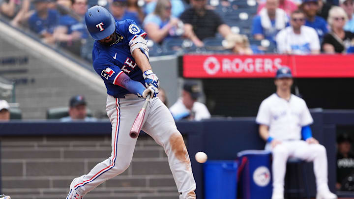 Texas Rangers second baseman Marcus Semien hits a single against the Toronto Blue Jays