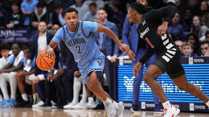 Dec 3, 2024; Villanova, Pennsylvania, USA; Villanova Wildcats guard Jhamir Brickus (2) drives against Cincinnati Bearcats guard Day Day Thomas (1) in the first half at William B. Finneran Pavilion. Mandatory Credit: Kyle Ross-Imagn Images Dec 3, 2024; Villanova, Pennsylvania, USA; Villanova Wildcats guard Jhamir Brickus (2) drives against Cincinnati Bearcats guard Day Day Thomas (1) in the first half at William B. Finneran Pavilion. Mandatory Credit: Kyle Ross-Imagn Images