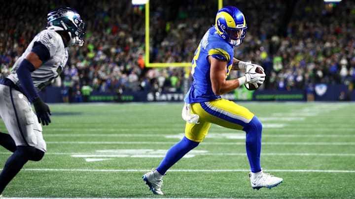 Dec 18, 2025; Seattle, Washington, USA; Los Angeles Rams tight end Terrance Ferguson (18) runs to score a touchdown against Seattle Seahawks safety Nick Emmanwori (3) in the first half at Lumen Field. Mandatory Credit: Kevin Ng-Imagn Images