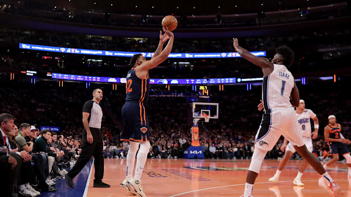 Dec 3, 2024; New York, New York, USA; New York Knicks center Karl-Anthony Towns (32) takes a three point shot against Orlando Magic forward Jonathan Isaac (1) during the third quarter at Madison Square Garden. Mandatory Credit: Brad Penner-Imagn Images Dec 3, 2024; New York, New York, USA; New York Knicks center Karl-Anthony Towns (32) takes a three point shot against Orlando Magic forward Jonathan Isaac (1) during the third quarter at Madison Square Garden. Mandatory Credit: Brad Penner-Imagn Images