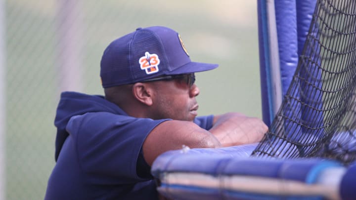 Milwaukee Brewers instructor Rickie Weeks watches batting practice during minor league workouts at