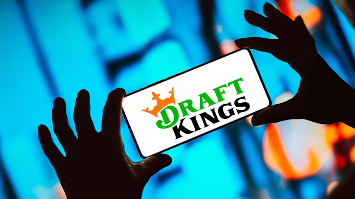 In this photo illustration, the DraftKings logo is displayed...