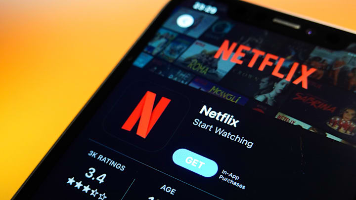 In this photo illustration, the Netflix logo is displayed in...