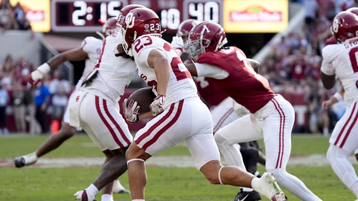 Nov 15, 2025; Tuscaloosa, Alabama, USA;  Oklahoma Sooners defensive back Eli Bowen (23) runs a interception back for a touchdown during the first half against the Alabama Crimson Tide at Saban Field at Bryant-Denny Stadium. Mandatory Credit: Gary Cosby-Imagn Images